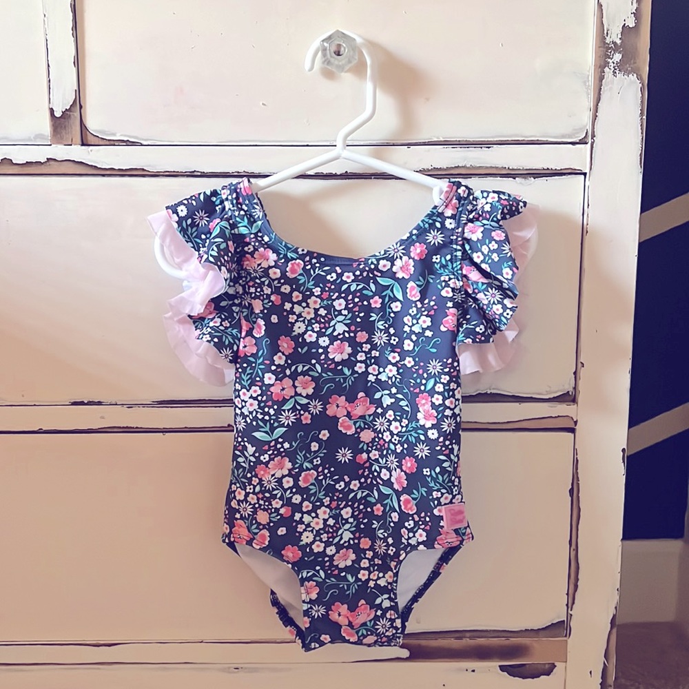 Navy floral Ruffle Butts swimsuit